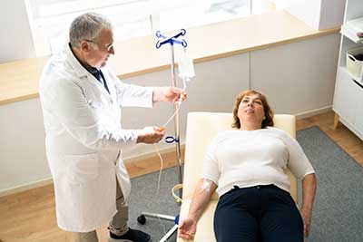 Woman receiving drip at enTrust Immediate care