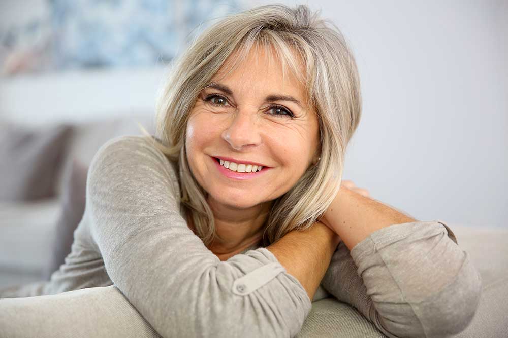 Smiling lady after undergoing IV Infusion Therapy at enTrust Immediate Care Center in Houston, TX